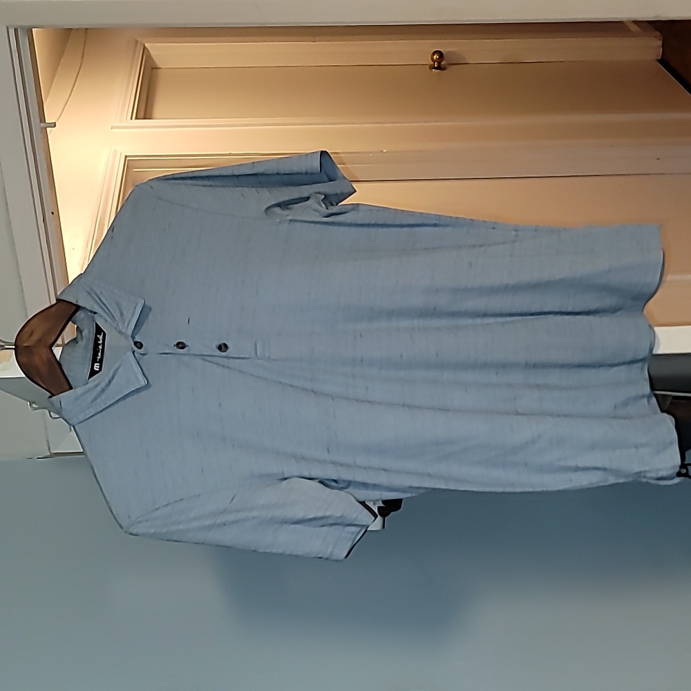 Travis Mathew polo shirt. Light Blue